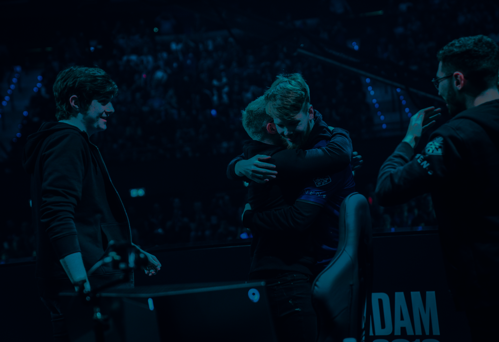 Esports team celebrating on stage